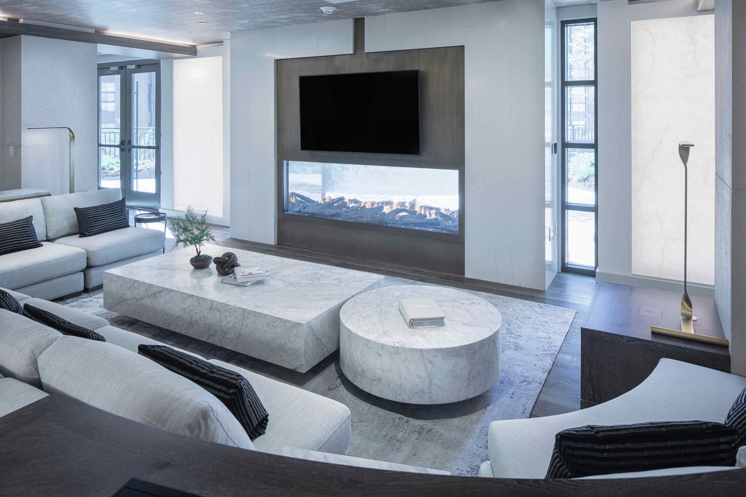 Clubroom showing lounge and TV above fireplace